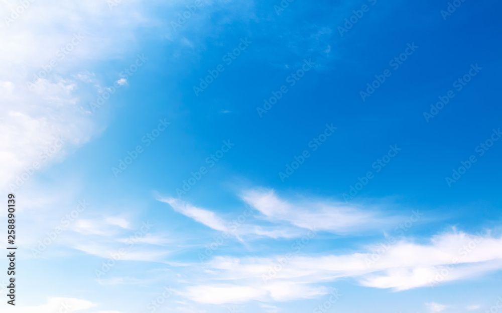 background of blue sky with soft clouds
