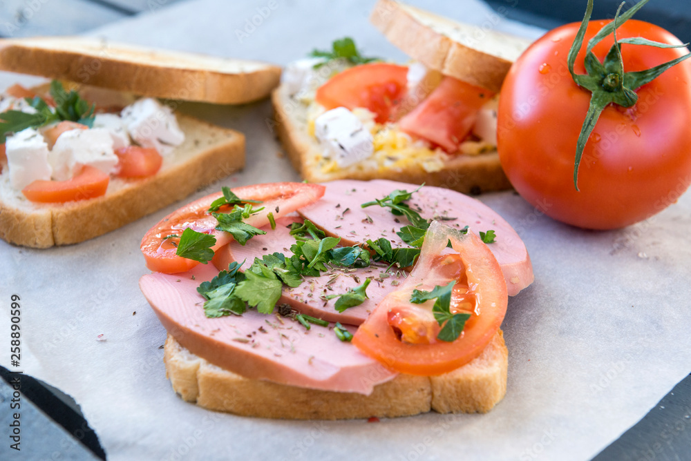 sandwich with sausage ,tomato and herbs sandwich with sausage ,tomato and herbs
