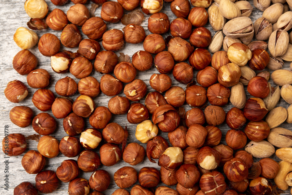 Hazelnut Background. Heap of peeled hazelnuts Hazelnut Background. Heap of peeled hazelnuts