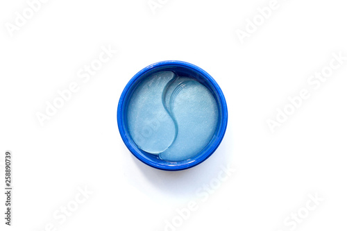 The concept of beauty, preservation of youth and self-care. Top view of a jar of blue hydrogel patches for eyes