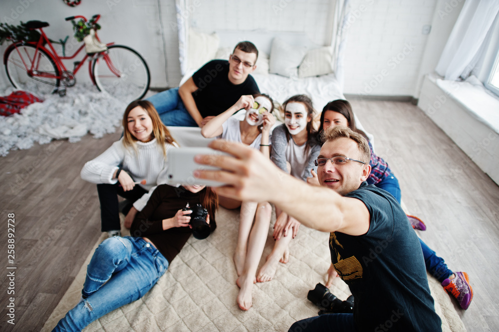 Group of people making selfie. Team photographer, designers and models stuff on photosession, master class of proffesionals.