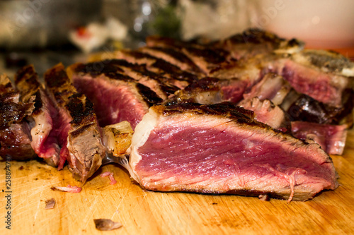 Florentine steak, t-bone steak on wooden cutting board