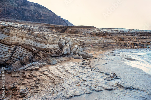 Obraz na płótnie clay shores of the dead sea. The medical clay is layers and is washed with salty water w salonie