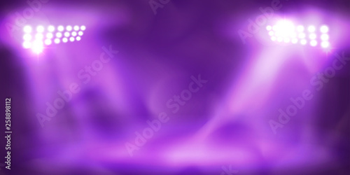 Spotlight Towers on Night Stadium in Smoke.