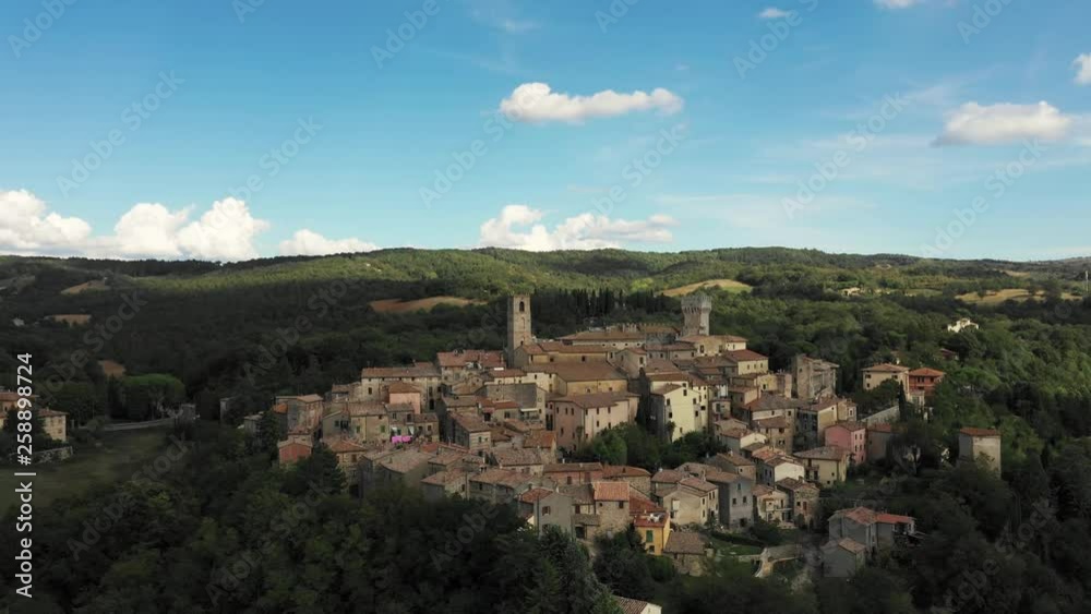Aerial, a beautiful view on a little medieval town in Tuscany, Italy on a sunny day Aerial, a beautiful view on a little medieval town in Tuscany, Italy on a sunny day
