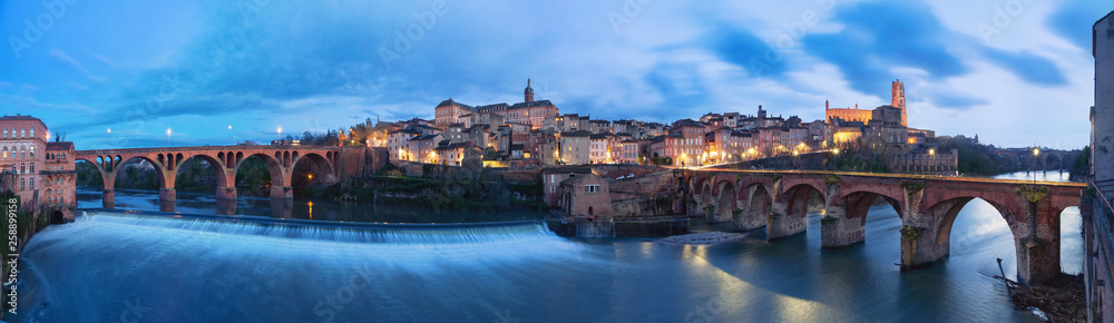Albi, France. Panoramic cityscape at dusk made from bank of Tarn river 
