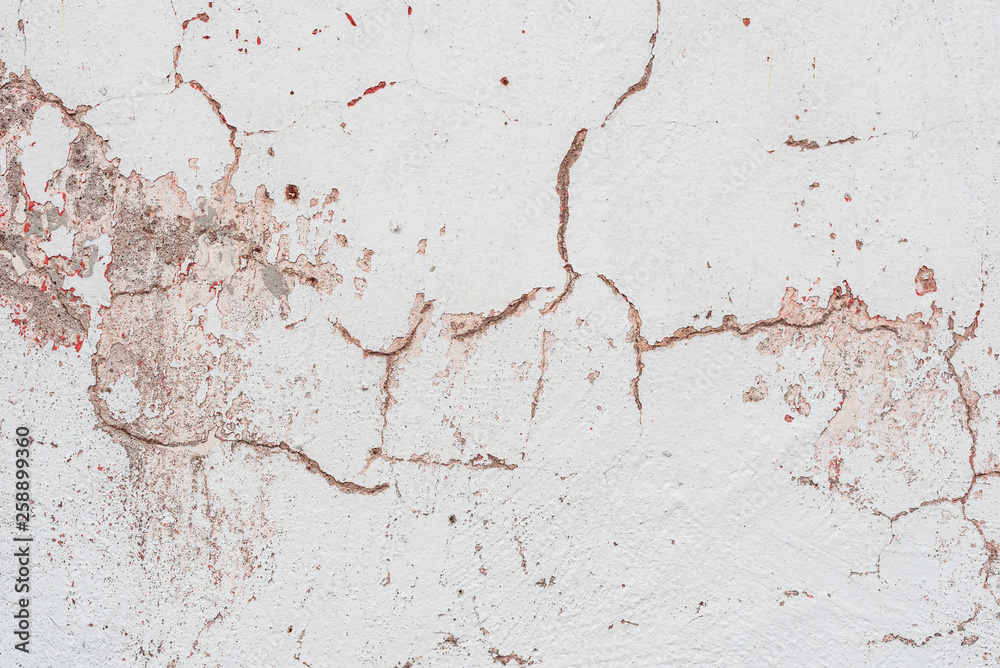 Wall fragment with scratches and cracks