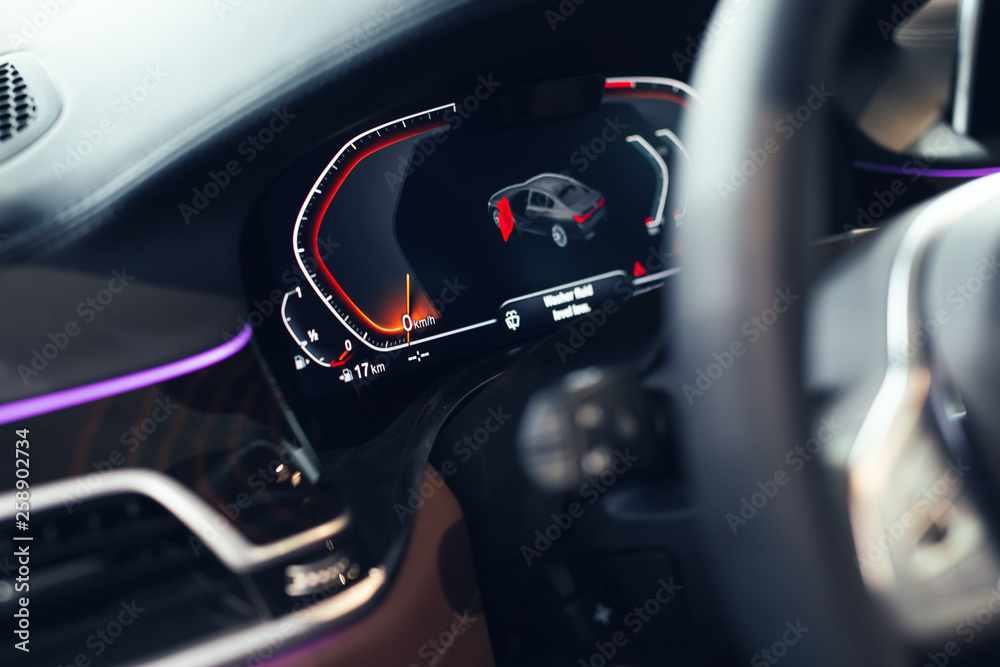 Modern car illuminated dashboard closeup Modern car illuminated dashboard closeup