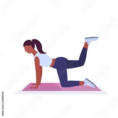 sporty woman doing fitness exercises on yoga mat african american girl training in gym aerobic workout healthy lifestyle concept flat white background