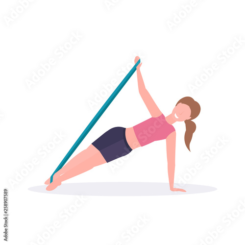 sporty woman doing exercises with resistance band girl training in gym stretching workout healthy lifestyle concept flat white background