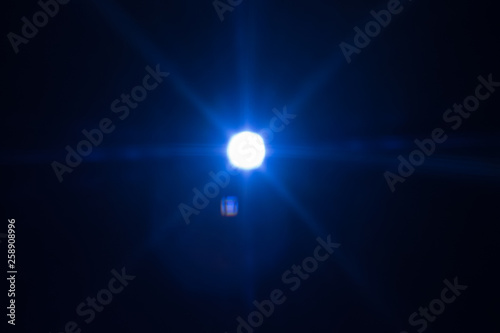 Wallpaper Mural Distant cold blue star glowing. Lens flare effect. Universe darkness Torontodigital.ca