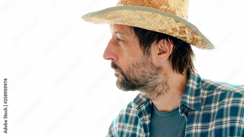 Portrait of thoughtful farmer on white background