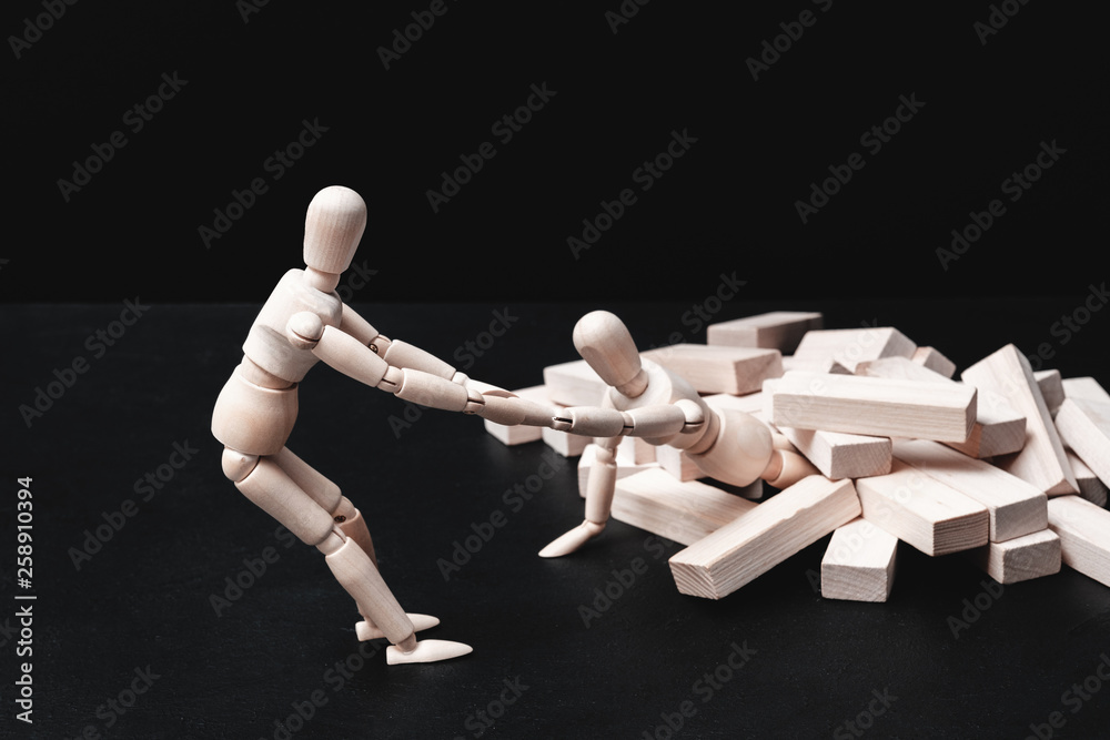 Helping hand. Support and problem solution. Teamwork and cooperation. Conceptual articulated mannequin composition. Helping hand. Support and problem solution. Teamwork and cooperation. Conceptual articulated mannequin composition.