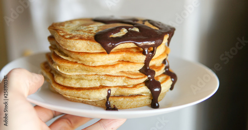 Breakfast, homemade classic american pancakes with chocolate syrup