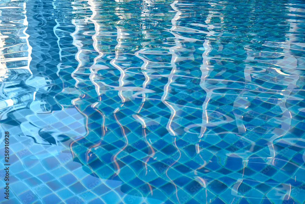 Swimming pool bottom with clear water surface textured background.