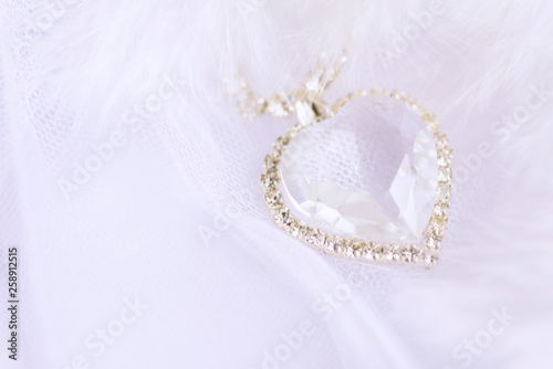 Crystal heart on a white background. Wedding background