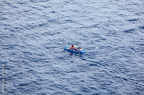  Couple canoeing in the Lampedusa sea