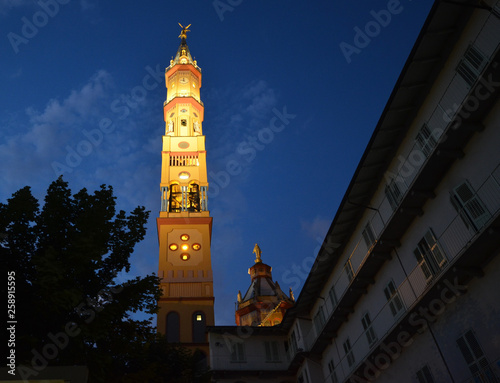 Vászonkép Night view of the bell tower of the Church of Our Lady of Suffrage and Santa Zita