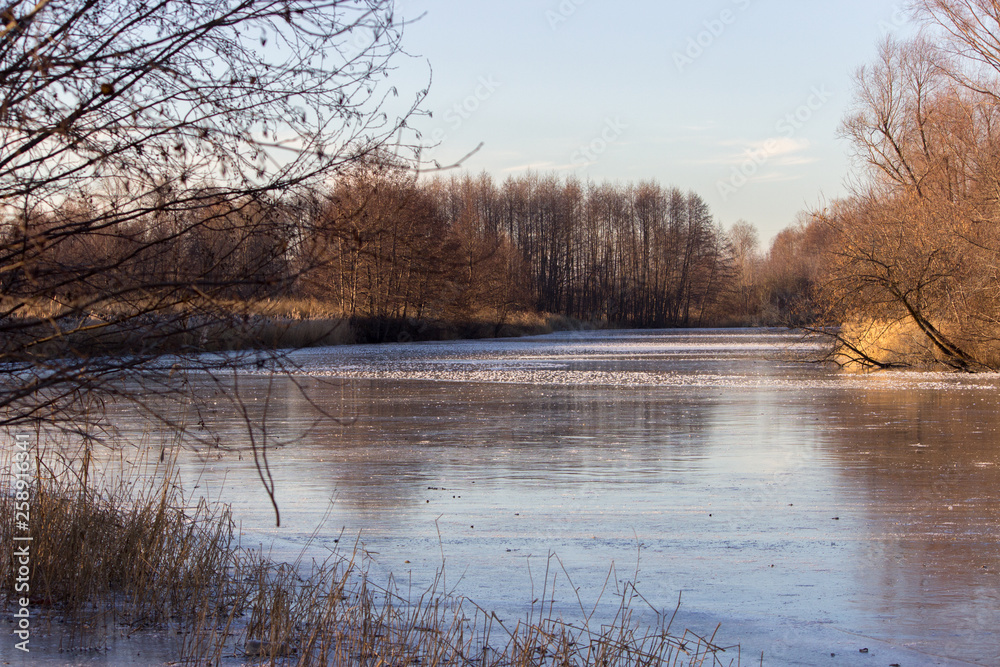 Fototapeta premium Ice covered winter river