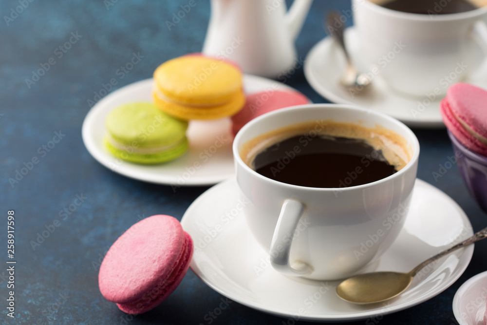 Two cups of coffee and sweets on table Two cups of coffee and sweets on table
