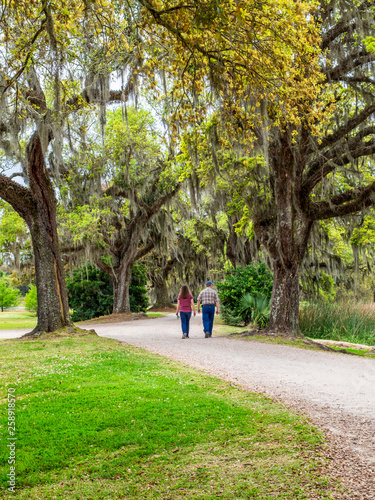 Father and daughter are enjoying the scenes of southern plantation photo