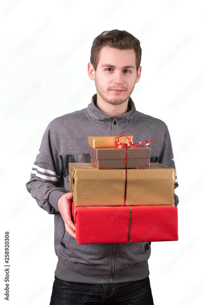 Young man holding a gift boxes. Young man holding a gift boxes.