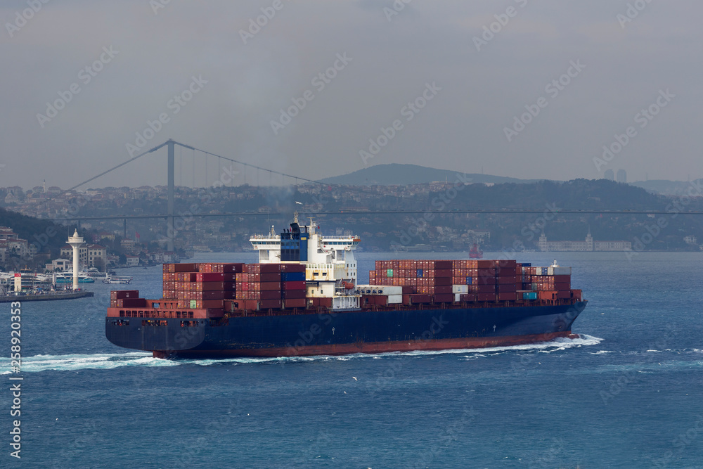 Container ship sailing in to the sea.