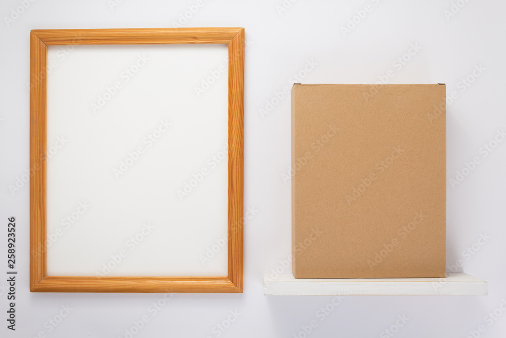 Fototapeta premium cardboard box on wooden shelf