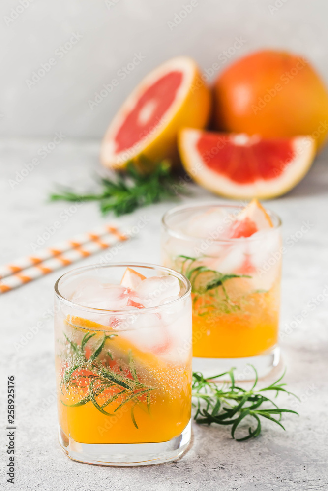 Grapefruit sunrise refreshing cocktail. Selective focus, space for text. Grapefruit sunrise refreshing cocktail. Selective focus, space for text.