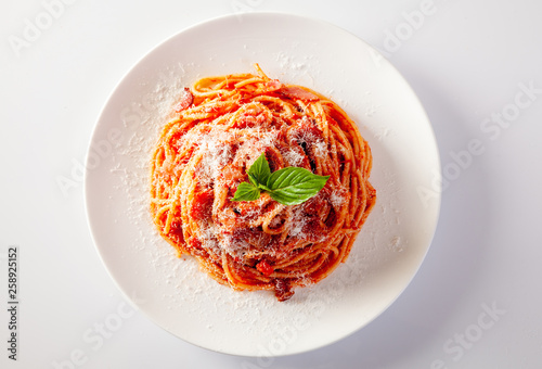 Spaghetti in a dish on a white background photo