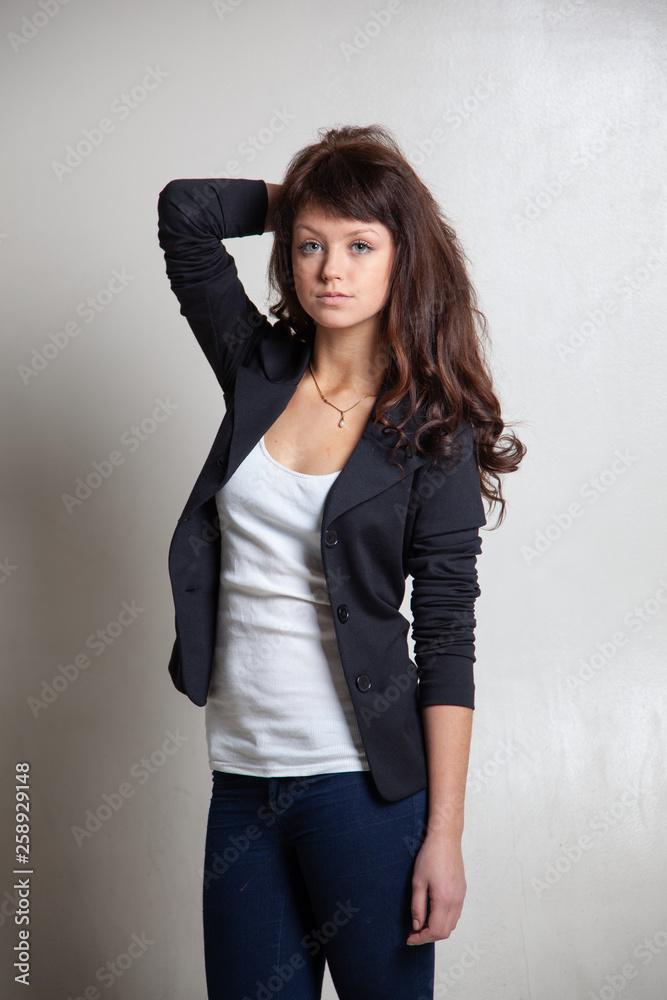 Beautiful brunette girl posing in the studio Beautiful brunette girl posing in the studio