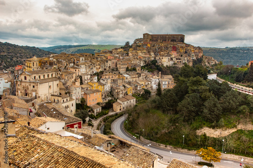 Panoramic view over the Italian old city Ragusa in cloudy day with its typical roof tops, Sicily, Italy