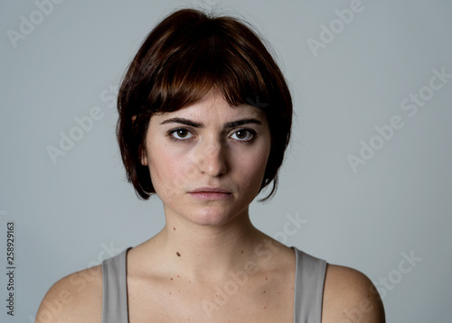 Portrait of sad and depressed woman feeling upset. Human expressions and negative emotions