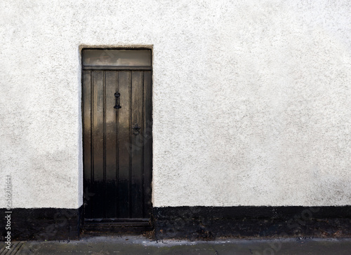 Exterior View of a Beautiful Old English Stone Cottage with door