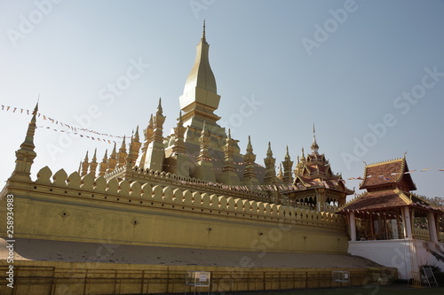 Vientiane Laos -, 1 Apr. 2019; Pha That Luang (Gold Stupa) or “Great Stupa” was built in 1566 after King Setthathirath had made Vientiane the new capital of the Lan Xang Kingdom. photo