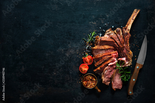 Bild auf Leinwand Grilled dry aged tomahawk steak sliced as close-up