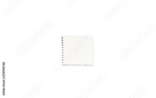 Blank white square postage stamp mockup, isolated, depth of field, 3d rendering. Empty mark for letter mock up, top view. Clear postal sticker for philately or mailing template. photo