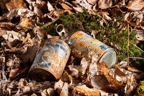Tin can waste on forest floor closeup