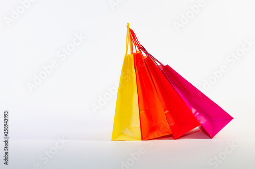 Set of colorful empty shopping bags isolated on the white background.