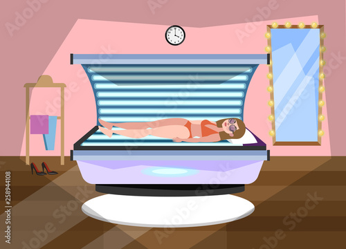 Happy smiling woman in solarium. Beautiful female