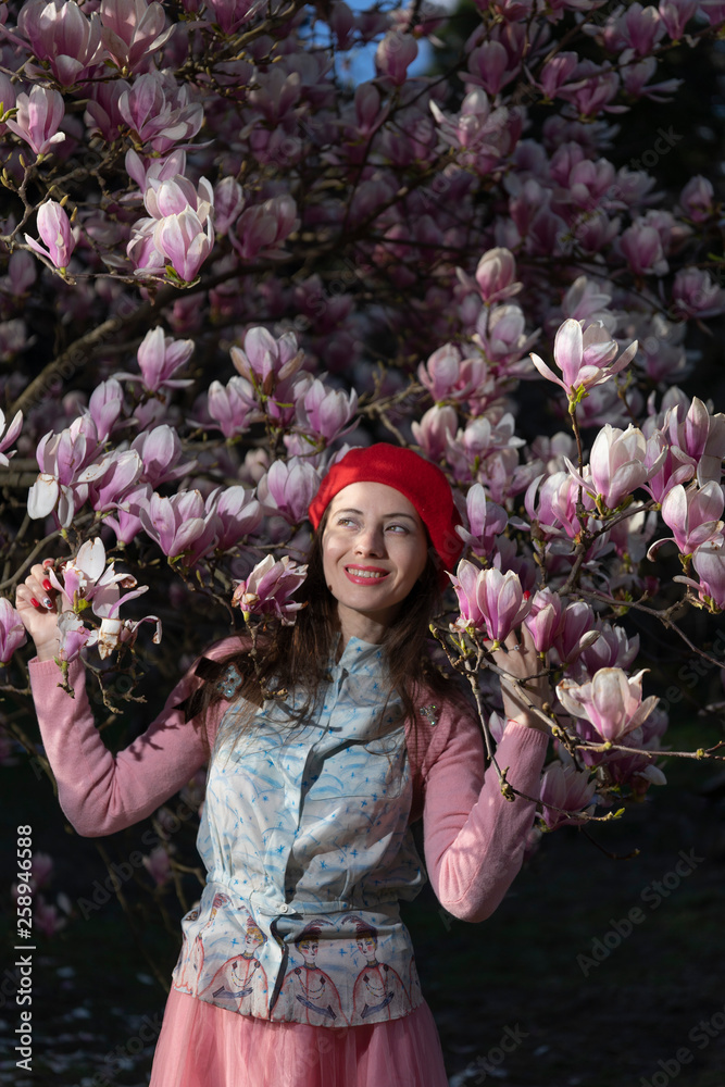 Fototapeta premium Portrait of a vintage girl in a spring garden