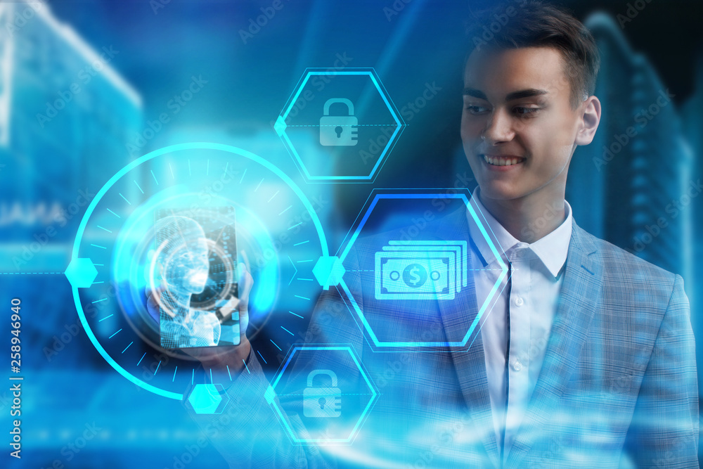 The concept of business, technology, the Internet and the network. A young entrepreneur working on a virtual screen of the future and sees the inscription: The concept of business, technology, the Internet and the network. A young entrepreneur working on a virtual screen of the future and sees the inscription: