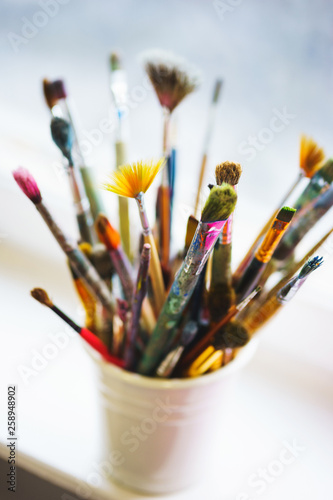 different brushes made from natural wool for watercolors and oil in a box, top view and beautiful bokeh.