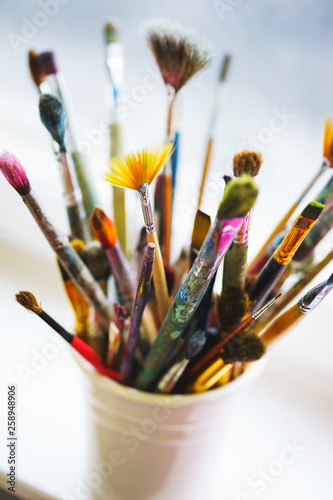 different brushes made from natural wool for watercolors and oil in a box, top view and beautiful bokeh.