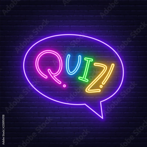Neon Lettering Quiz on a brick wall background. Multicolored inscription.