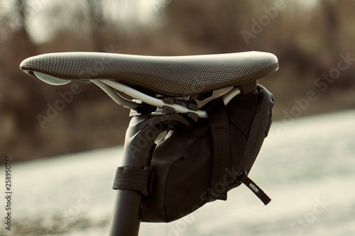 Bike seat pack under bicycle saddle. Small saddle pack attached with velcro photo