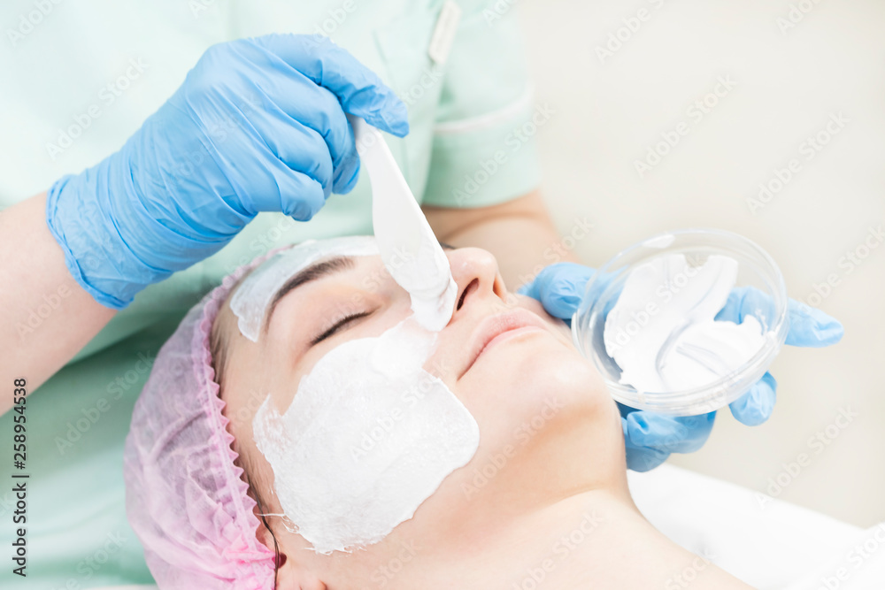 Process cosmetic mask of massage and facials in beauty salon 
