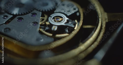 Old clock mechanical part working white lightning from right side static supermacro angle viaw ProRes 4444