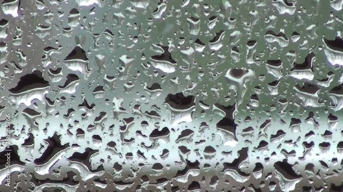 Drops on glass of the window on a rainy day 