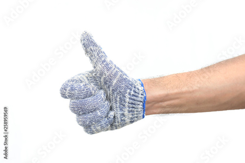 giving the thumbs up sign. Arms of man wearing a handful of gloves photo